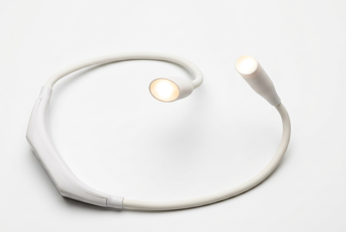 White neck light with both lamps illuminated on a white background