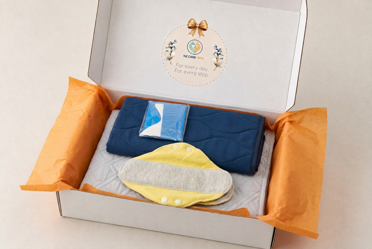 Incontinence Support Kit in an open branded white gift box with orange tissue lining